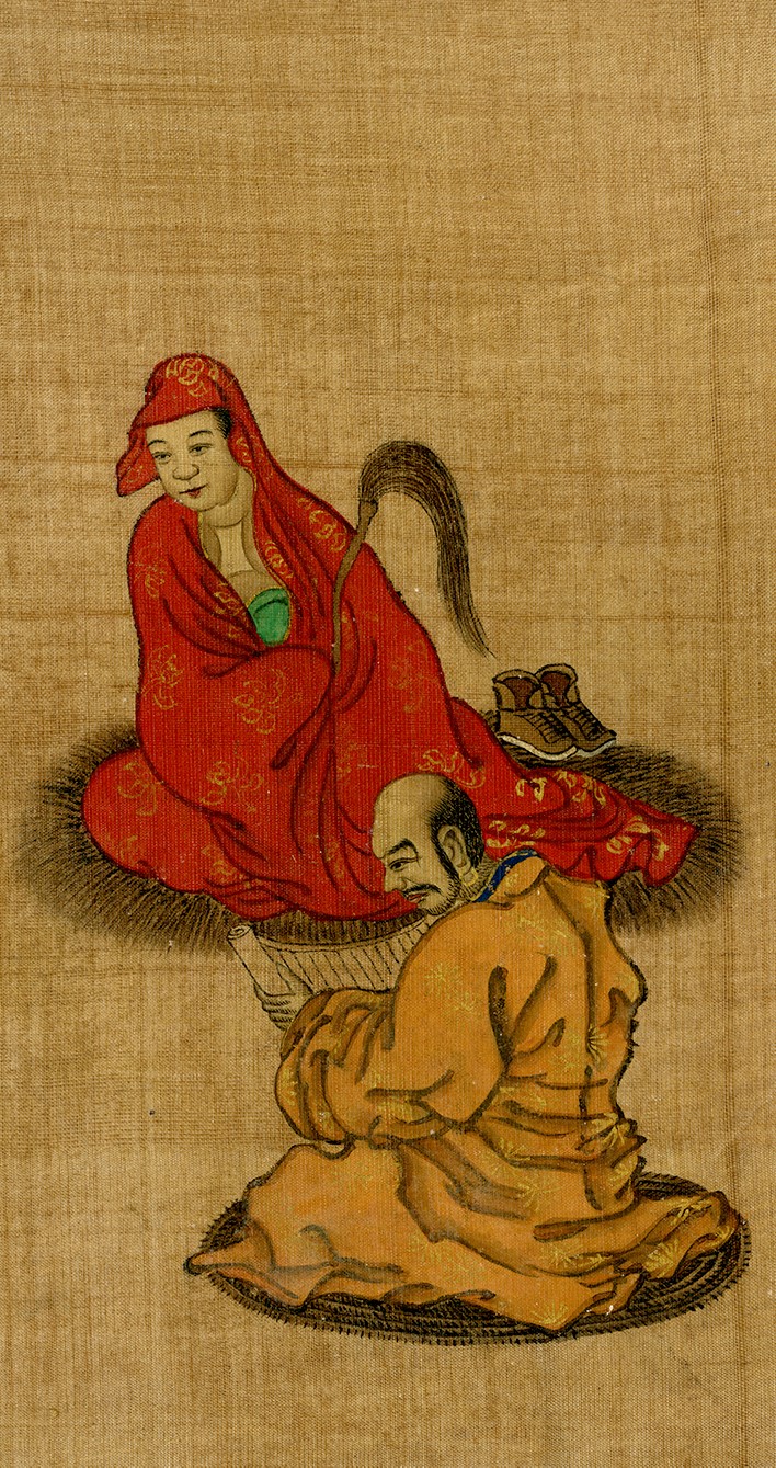 An image depicting Luohans, or followers of Buddha. A man and woman sit across from each other. The man is reading a scroll.